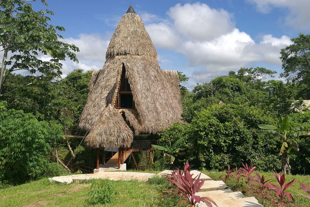 The River Palace treehouse, built twenty feet above three converging rivers at Rancho Delicioso
